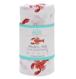 Rolled white swaddle blanket with red lobster print and product label