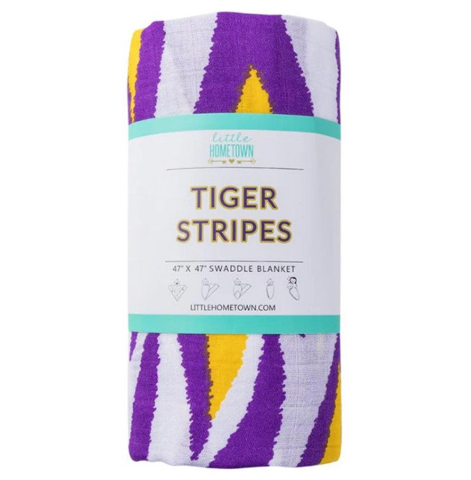 Folded swaddle blanket with purple white and yellow tiger stripe pattern