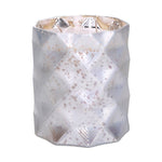 A silver glass candle holder with a geometric diamond pattern.