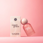 Product photograph by Bridgewater Candle Company of Sweet Grace Eau de Parfum, showing its light beige rectangular box with '1.5 FL OZ (46 ml)' and a tilted pink frosted glass bottle featuring a rounded light pink cap, all on a vibrant pink background