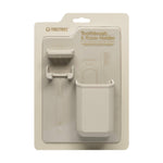 Product photography by Tooletries of a sand-beige silicone toothbrush and razor holder in retail packaging featuring the brand logo, a textured diamond-patterned backing, and a sleek matte finish