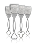Product photography showing four identical grey The Wand wine purifiers each with a shield-shaped top containing a textured filter and distinct handle bottoms shaped as a square a heart a clover and a teardrop all reflected on a white surface