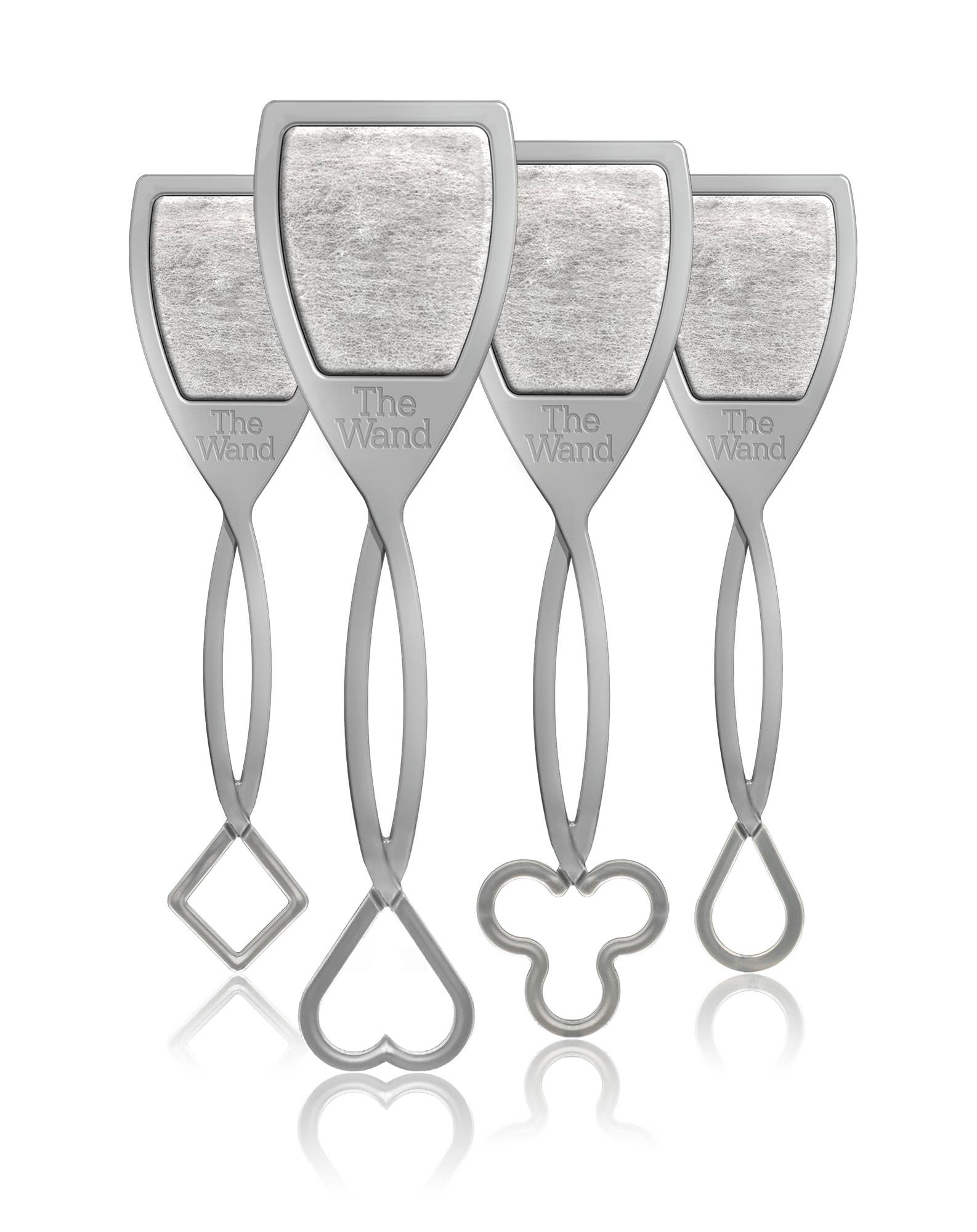 Product photography showing four identical grey The Wand wine purifiers each with a shield-shaped top containing a textured filter and distinct handle bottoms shaped as a square a heart a clover and a teardrop all reflected on a white surface