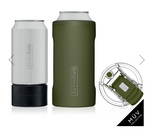 Product photography of two BruMate insulated can coolers, one matte white with a removable black base and one matte olive green, both displaying the BRÜMATE logo, accompanied by a clear MÜV collection lid with an olive green flip-top on a white background