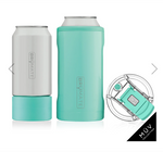 Product photograph by Brumate showcasing a white can-shaped Brümate Hopsulator Slim and a taller teal Brümate Hopsulator Trio alongside a clear spill-proof lid with a teal flip-top closure from the MÜV COLLECTION