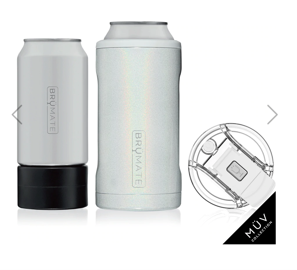 BrüMate insulated drinkware including a matte white Hopsulator Slim on a black base, a glitter white iridescent Toddy 22oz, and a clear MÜV Collection spill-proof lid with a white flip-top, all arranged on a white background