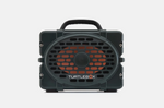 Digital photograph of a Turtlebox speaker, a rugged dark green portable speaker on a plain white studio background featuring an orange speaker cone visible behind an oval black protective grille, a sturdy black top handle, and the white TURTLEBOX logo prominently displayed