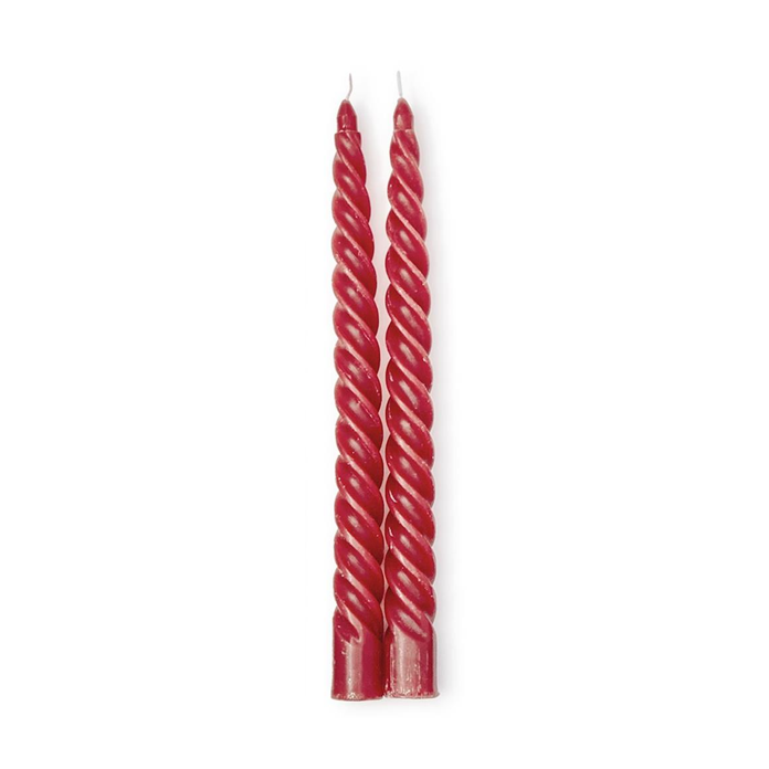 Two unlit crimson red spiral taper candles with visible wicks