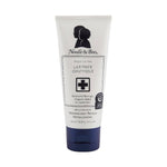 Product by Noodle & Boo, a white tube of fragrance-free Ultimate Ointment with a navy blue cap, features black silhouettes of a parent and child and a medical cross, stating it's Accepted by National Eczema Association and Dermatologist-Tested & Hypoallergenic
