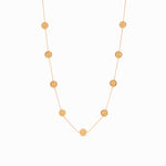 Gold chain necklace featuring evenly spaced circular coin charms with embossed cross designs