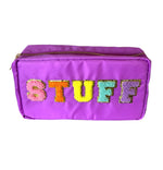 Purple nylon rectangular pouch featuring a gold zipper and the word STUFF spelled out in pink, orange, yellow, teal, and purple chenille patch letters with gold glitter outlines