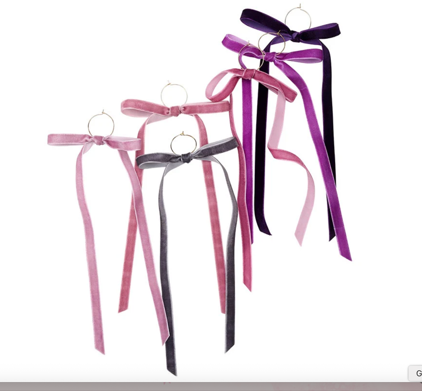 Five velvet ribbon bows with long tails and gold ring accents in shades of dusty rose dark pink charcoal gray vibrant purple and deep plum displayed on a white background
