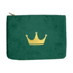 Emerald green velvet zippered pouch featuring a prominent gold crown graphic and a subtle matching crown logo on the bottom right