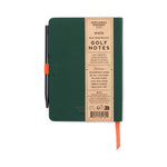 Gentlemen's Hardware dark green waterproof Golf Notes journal featuring a black ballpoint pen with an orange elastic holder, a kraft paper band detailing waterproof paper and 98 golf log pages, and an orange ribbon bookmark