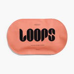 A salmon pink oval-shaped Loops Weekly Reset 1 Face Mask package featuring a bold black LOOPS logo and the tagline For Anytime Anywhere Anyplace on a clean white studio background