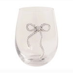 Clear glass stemless wine glass featuring a sparkling silver rhinestone bow embellishment