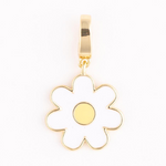 Gold flower charm with white enamel petals, a yellow enamel center, and a shiny gold bail
