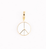 Gold tone peace sign charm with white enamel, a round shape, and a top clip bail
