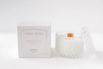White tea scented candle in a textured glass jar with a matching lid and its white product box