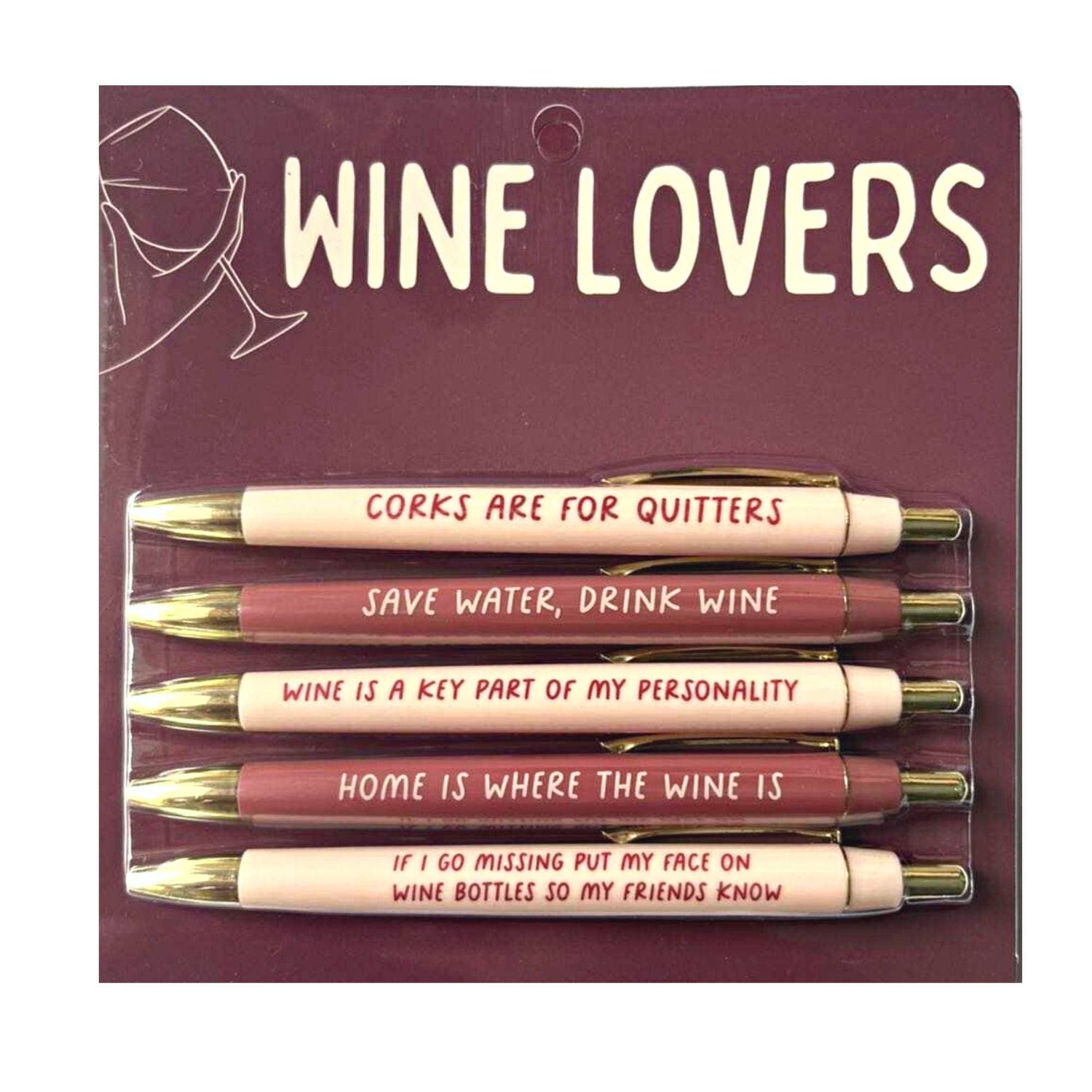 A packaged set of five "Wine Lovers" ballpoint pens, featuring cream and maroon barrels with gold tips, each inscribed with a humorous wine-themed quote such as "Corks are for quitters" or "Save water, drink wine", presented on a dark red cardboard backing with a white outline of a hand holding a wine glass