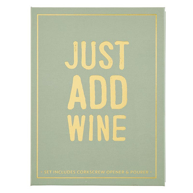 Printed cardboard box with a sage green background and gold foil text reading JUST ADD WINE, featuring a thin gold border and detailing that the set includes a corkscrew opener and pourer