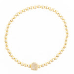 Gold beaded stretch bracelet with a square charm featuring the letter K encrusted with small clear stones