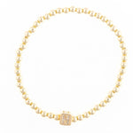 Gold bead bracelet with a central square charm featuring the letter N in crystals