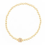 Gold beaded stretch bracelet with a square charm featuring the letter P in pavé stones
