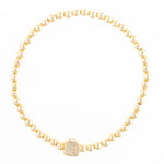 Gold beaded stretch bracelet with a square charm featuring the letter R in pavé stones