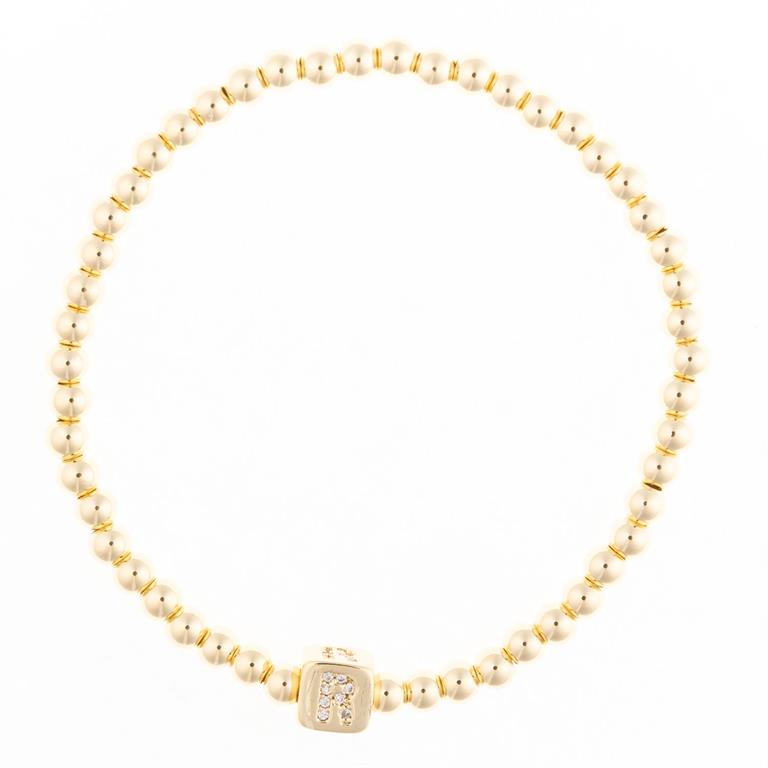 Gold beaded stretch bracelet with a square charm featuring the letter R in pavé stones
