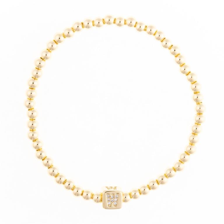 Gold beaded stretch bracelet with a square charm featuring the letter W in pave crystals