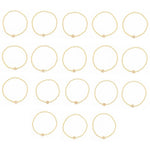 Collection of seventeen gold beaded rings with small square letter charms