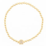Gold beaded stretch bracelet with a single square charm featuring the letter A in pavé stones