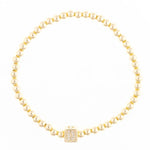 Gold bead bracelet with a single square charm featuring the letter D in pave diamonds