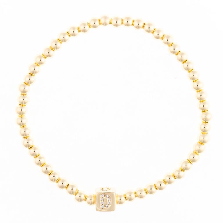 Gold bead bracelet with a single square charm featuring the letter D in pave diamonds