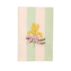 Embroidered textile featuring a bouquet of bright yellow mimosa flowers tied with a soft pink ribbon bow and dark green foliage on a background of alternating light pink and mint green vertical stripes