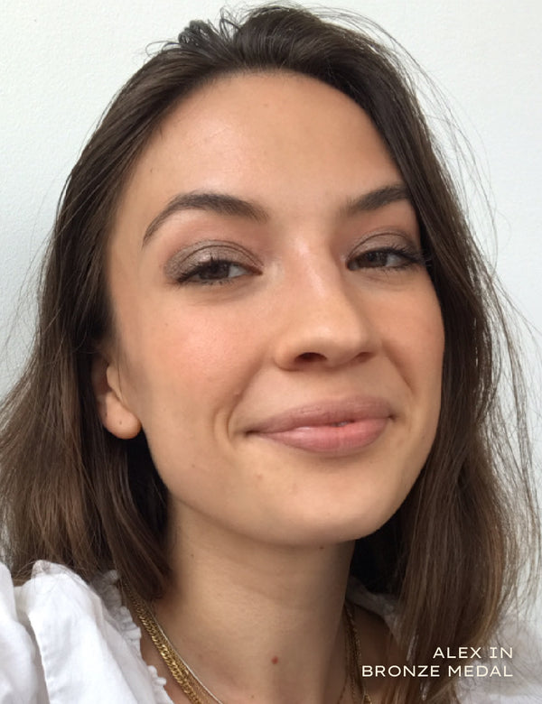 Close up portrait of a woman wearing bronze eyeshadow