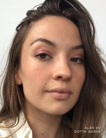 Person with light pink eyeshadow and natural makeup