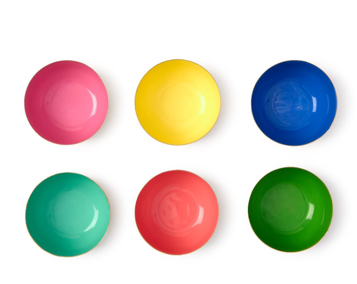 Six vibrant ceramic bowls in pink yellow blue teal red and green, each with a delicate golden rim, arranged on a white background