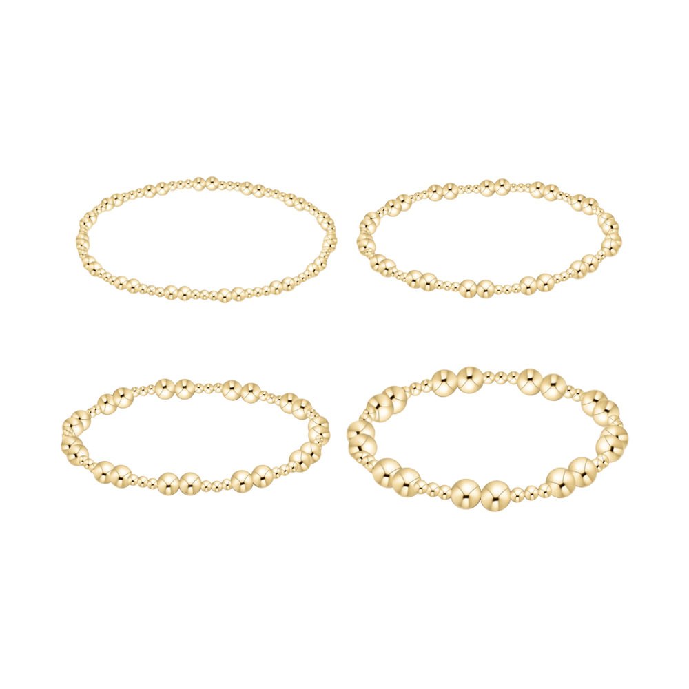 Four gold beaded stretch bracelets with varying bead sizes