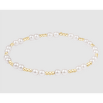 Stretch bracelet featuring alternating white pearls and small gold beads