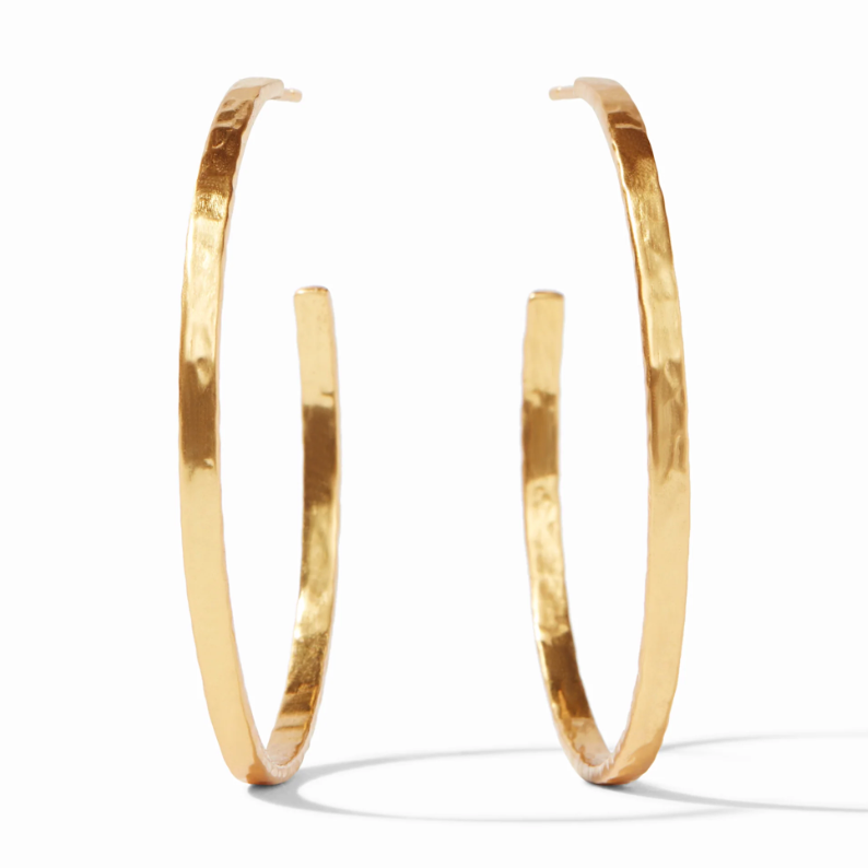 Pair of large gold hoop earrings with a hammered texture