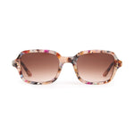 Sunglasses with floral frame and brown gradient lenses on a white background