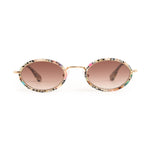 Sunglasses with colorful frame and brown lenses on a white background