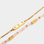 Gold chain bracelet with star engraved bar and beaded bracelet with gold accents