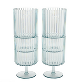 Two clear acrylic glasses with ribbed design on a white background