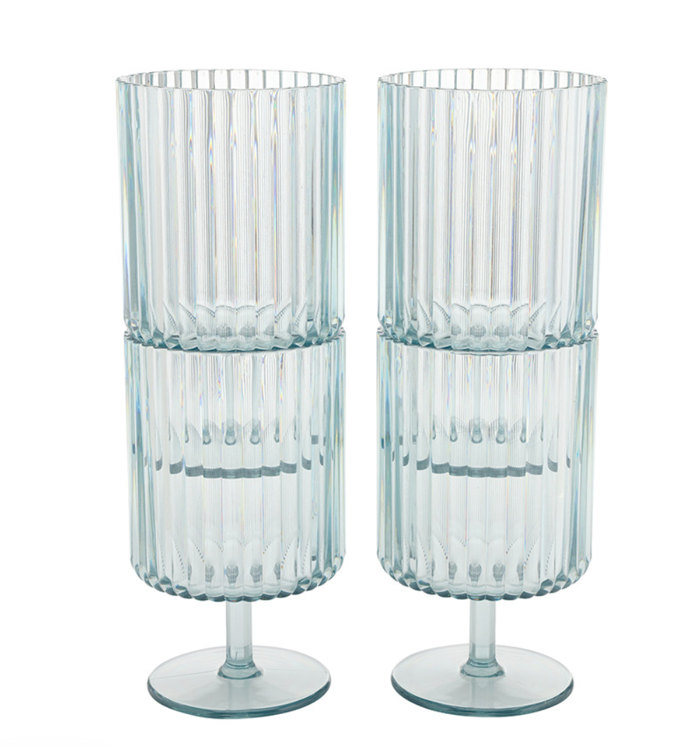 Two clear acrylic glasses with ribbed design on a white background