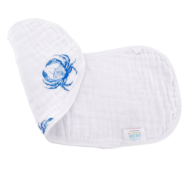 Muslin cotton burp cloth by Little Hometown featuring a detailed blue crab print on a soft white crinkled fabric with a small branded logo tag visible at the bottom edge