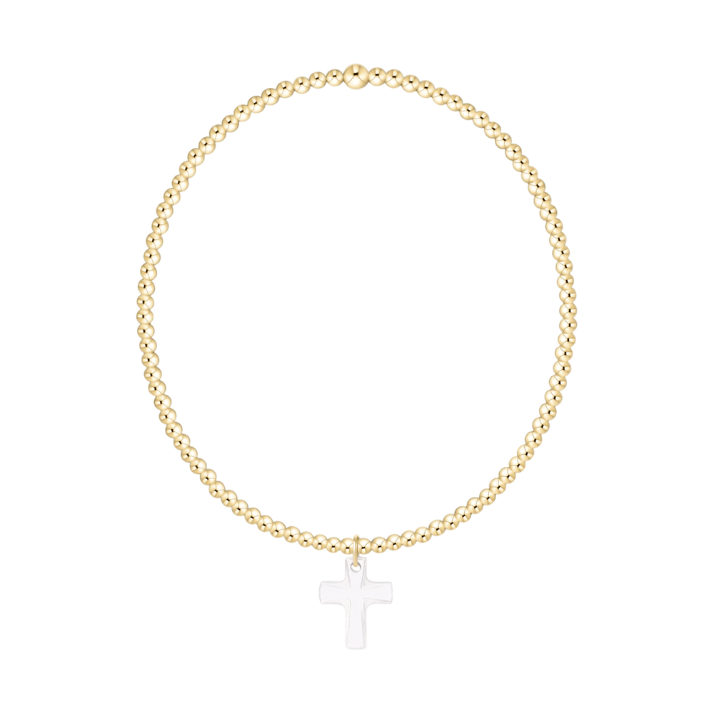 Gold beaded stretch bracelet with a silver cross charm