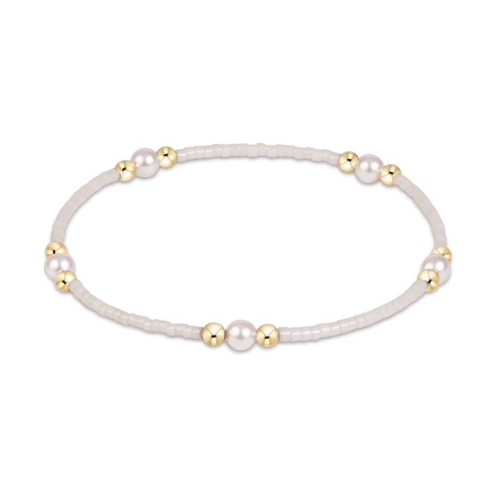 White seed bead stretch bracelet with pearl and gold bead clusters